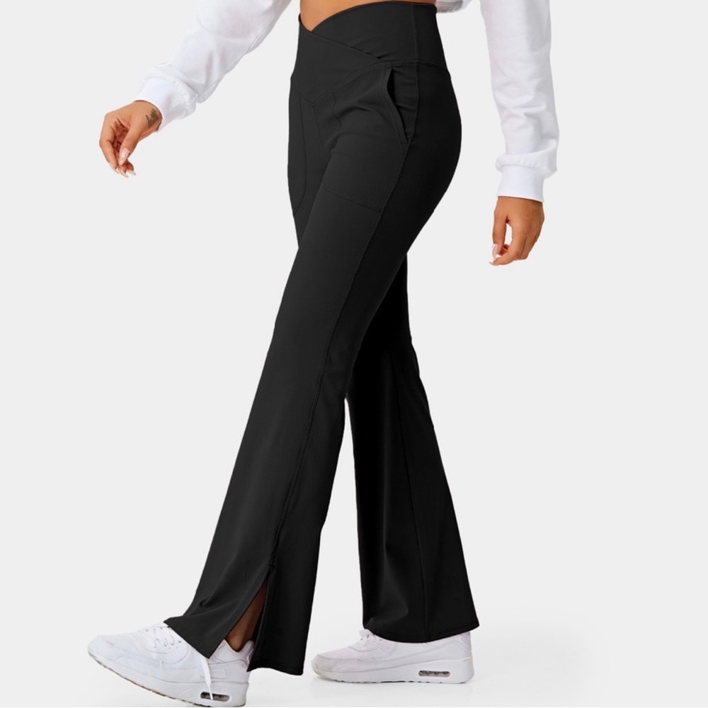 Cross waist flare leggings by Halara